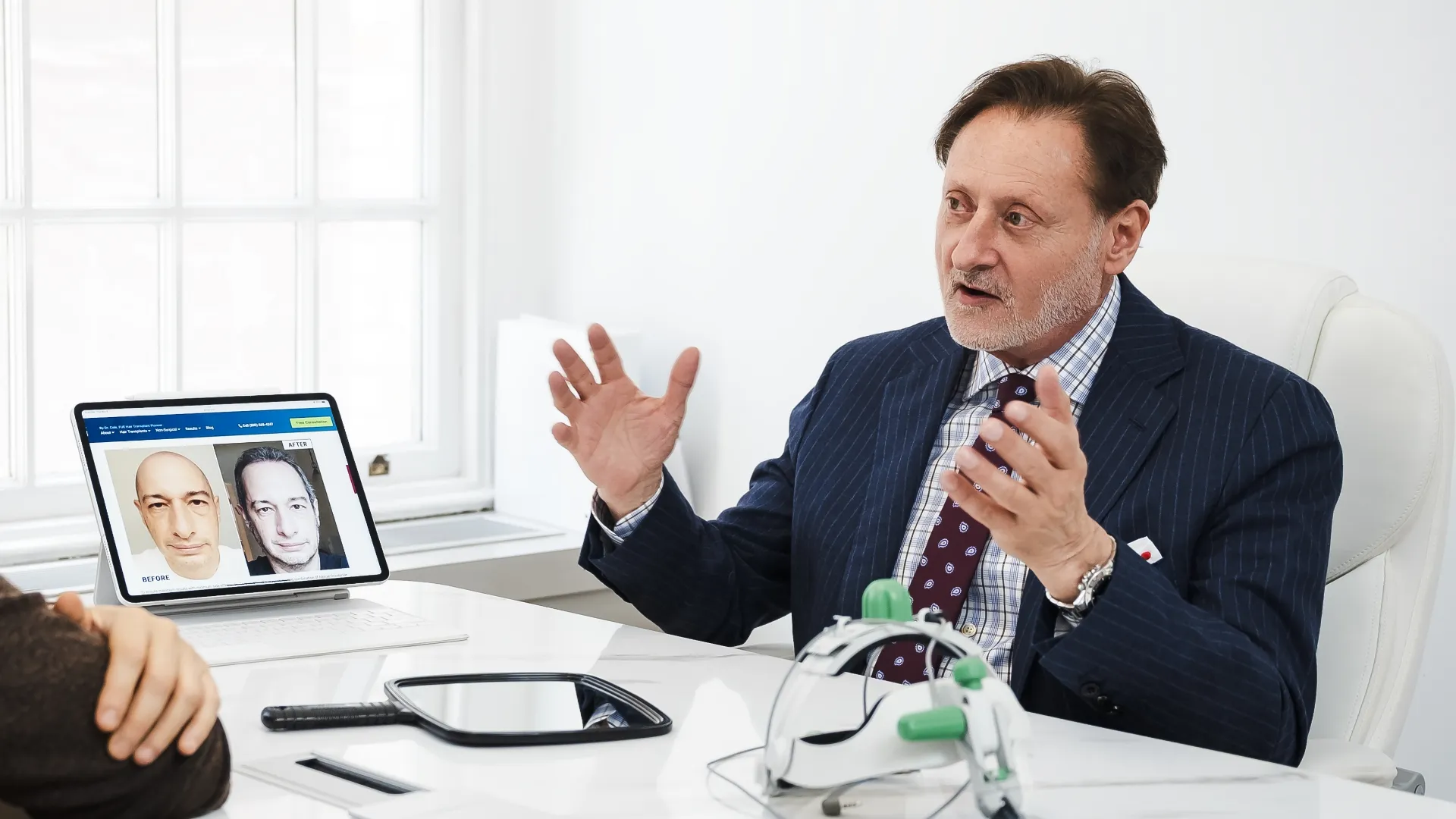 Dr. Cole at ForHair Clinic with a patient having a consultation